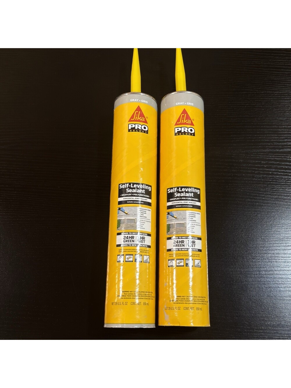 ( 2).  Sikaflex Self Leveling Sealant, Gray, polyurethane.